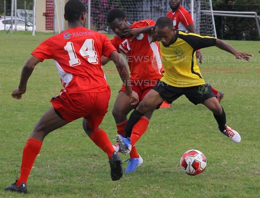 Osaze Springer (R), of RSSR FC, and Bethel United’s Ackel Carrington (17) vie for the ball during a Super League encounter, at the Hasely Crawford Stadium,on Sunday. - ROGER JACOB