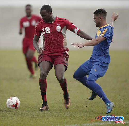 Photo: Bethel United defender Makan Hislop (left) shrugs off a challenge from FC Santa Rosa attacker Rashad Griffith during TTSL One action at the Arima Velodrome on 18 June 2017.  Santa Rosa won 2-0. ... (Courtesy Annalicia Caruth/Wired868)