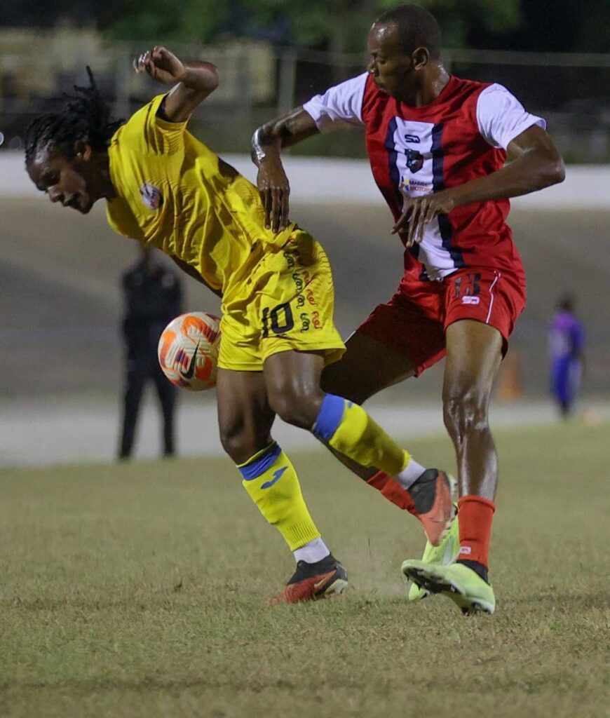 Caledonia FC striker Kevon Woodley (right) jostles for possession with AC PoS playmaker Duane Muckette. File photo courtesy TTPFL. -