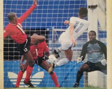 Photo: Trinidad and Tobago goalkeeper Earl “Spiderman” Carter (right) braces for a United States effort while teammates Paul Elliot-Allen (left) and Brian Williams look on during the 1990 World Cup qualifying series.