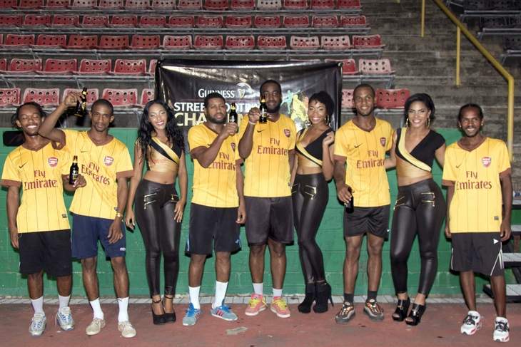 NORTH ZONE CHAMPS: Guinness Street Football Challenge 2015 north zone winners, Basic pose with representatives of the Guinness promotional team following their victory at the Jean Pierre Complex, Port of Spain, on Saturday.