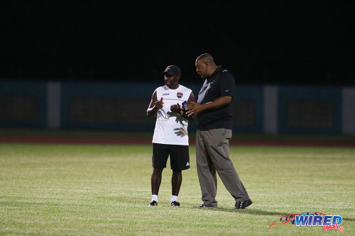 Photo: TTFA president David John-Williams (right) has a word with Trinidad and Tobago National Under-17 Team coach Russell Latapy on the training ground before the CFU competition. (Courtesy Chevaughn Christopher/Wired868)