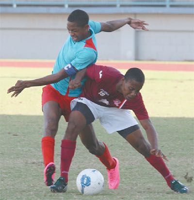 Kurlan Khan, captain of Marabella Family Crisis Centre, left, puts in a challenge on La Horquetta SA’s Kerron St Cyr in their CNG National Super League Premier Division match at the Larry Gomes Stadium, Malabar, on January 7. Marabella Family won 4–2. Photo: Anthony Harris