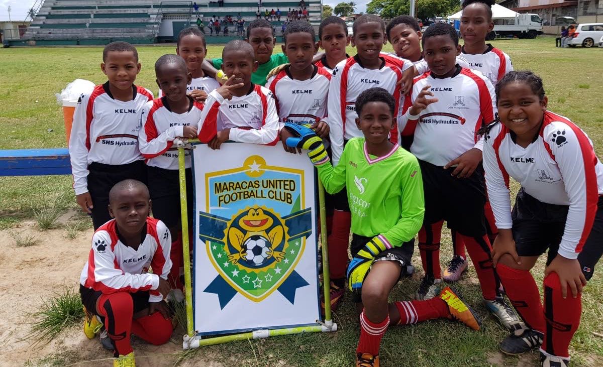 SWEET VICTORY: Maracas United FC players enjoy their first win of the Republic Youth Football League on Saturday at Constantine Park, Macoya.