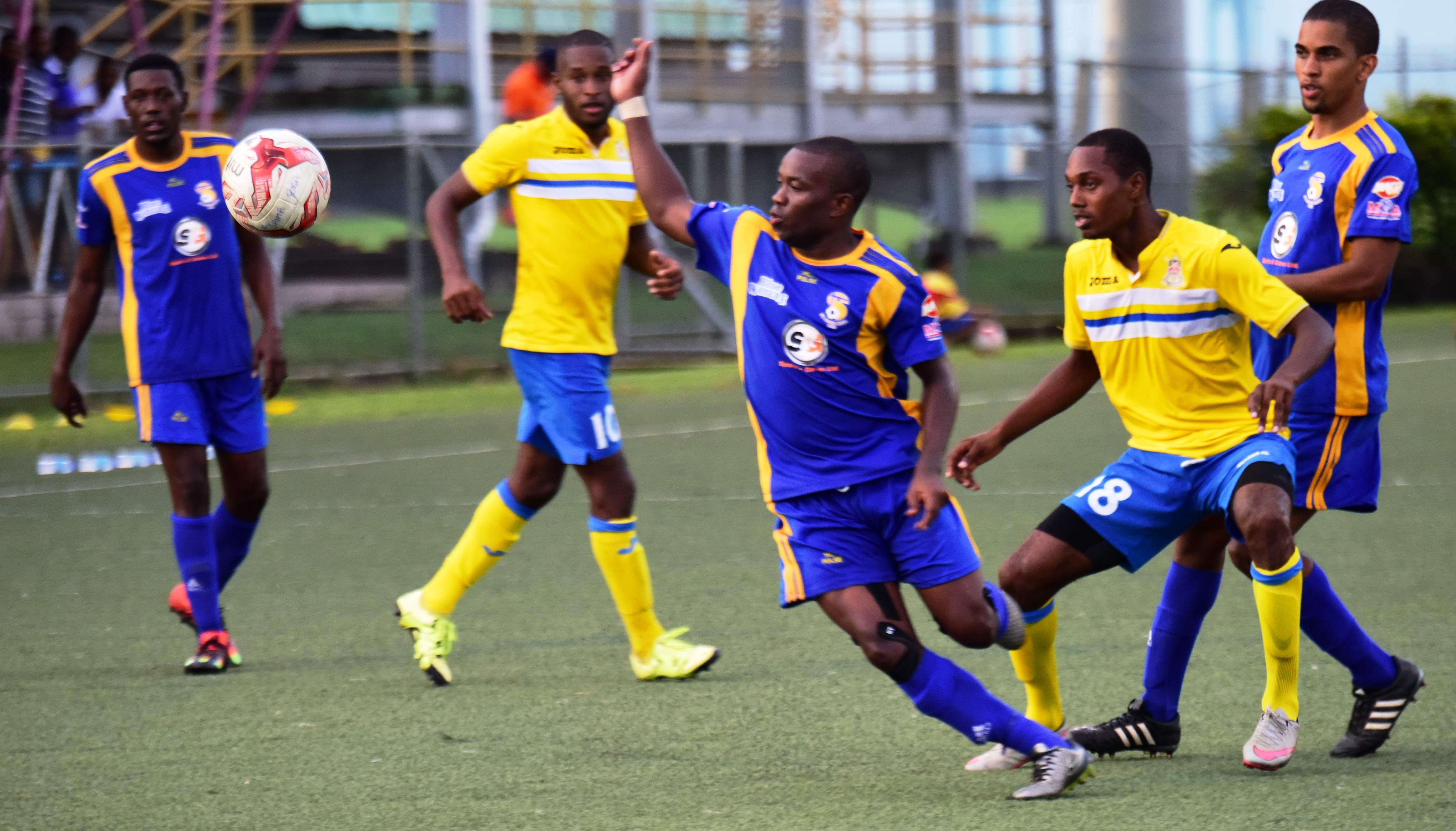 National Super League action between 2016 Champions FC Santa Rosa (purple) and Defence Force earlier this season. The teams filled the top two spot in the competition.
