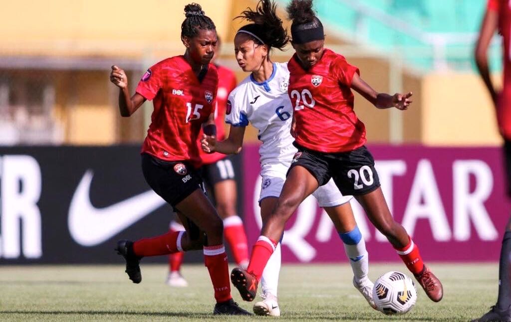 T&T’s Jada Graham, right, controls the ball as Nicaragua captain Vanessa Altamirano, centre, vies for possession during the U17 Concacaf Women’s Championship match ,at the Felix Sanchez Olympic Stadium in Santo Domingo, Dominican Republic, on Monday. Photo source: TTFA Media