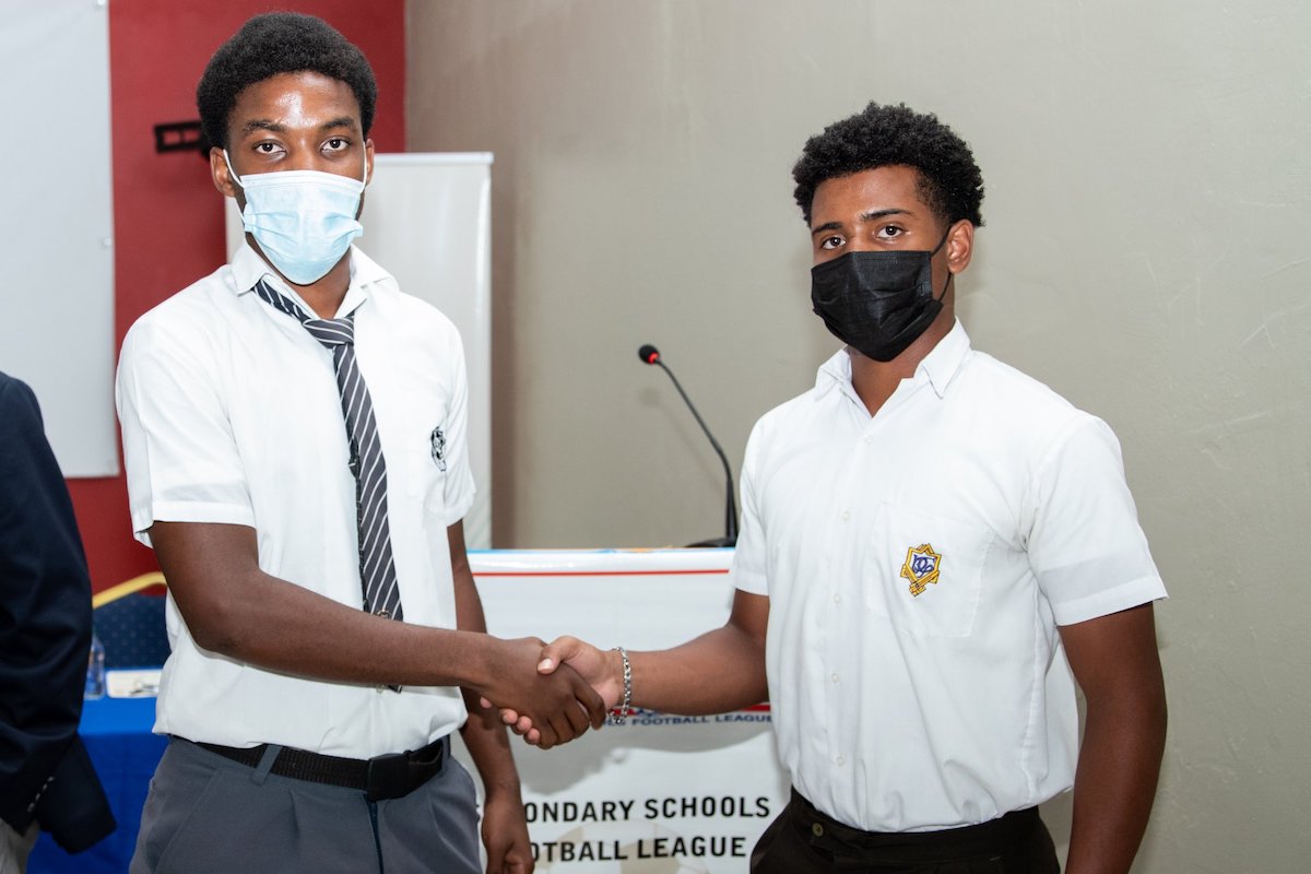 Presentation College captain (R) and Naparima College captain during the Media Launch of the Secondary School Football League at the Ato Boldon Stadium on September 7, 2022 in Couva. (Photo by Daniel Prentice)