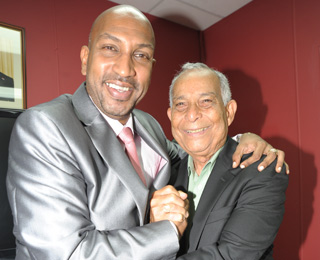 BOSOM BUDDIES: Minister of Sport Anil Roberts, left, embraces Trinidad and Tobago Football Federation president Oliver Camps during yesterday's breakfast meeting at Jaffa Restaurant, Queen's Park Oval. It was announced that an accommodation had been made which will see Government funding Trinidad and Tobago's Brazil 2014 World Cup qualifying campaign. See Page 53. –Photo: Anisto Alves