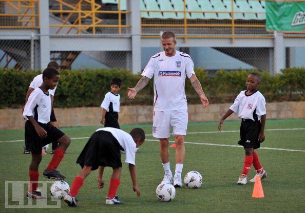 David Beckham training some kids at the Marvin Lee Stadium during his last T&T visit in 2008. (PHOTO - LIFE).