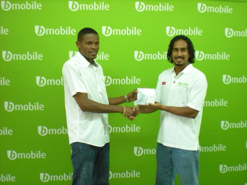 (right) Tajh Maharaj, Marketing Assistant at bmobile, presents player of the month, Marc Borde, with a bmobile phone.