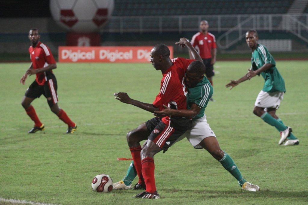 Senior team defender Daneil Cyrus up against a Guyanese attacker.