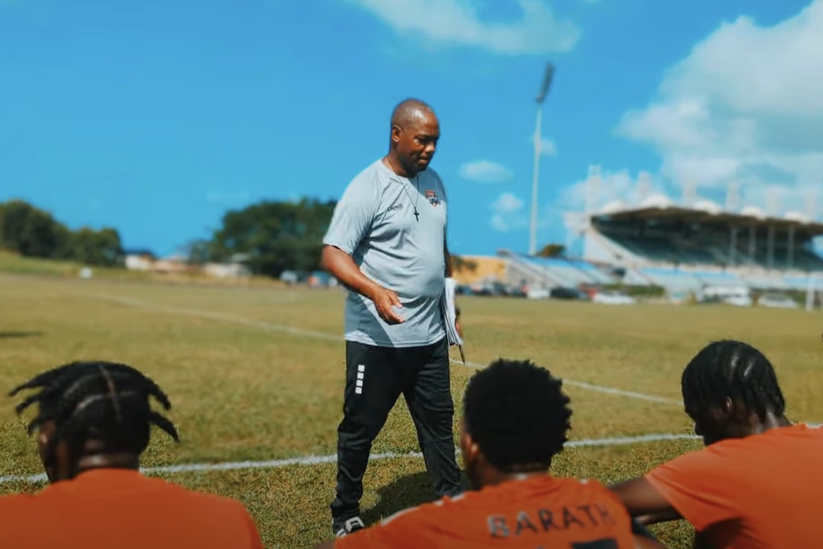 Trinidad and Tobago Men's U-20 Head Coach Brian Haynes talks to his players during a training session