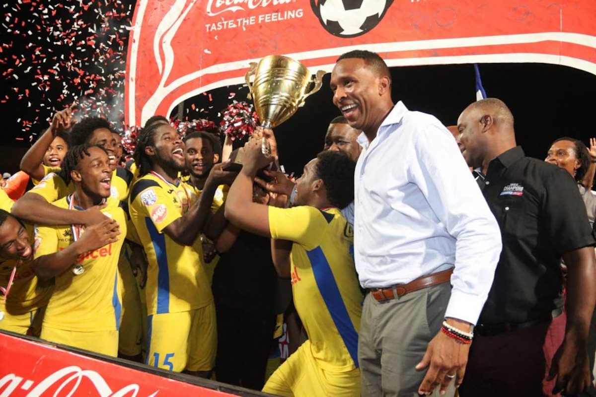 In this December 4, 2019 file photo, Presentation College players celebrate after defeating San Juan North Secondary in the SSFL Intercol final at the Ato Boldon Stadium, Couva