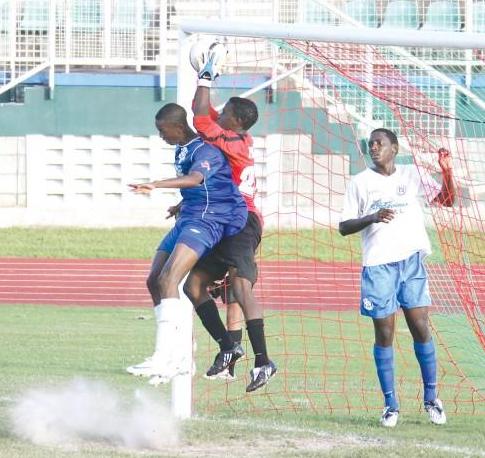THE GOALKEEPER makes a timely save in the South Zone Final of the Coca-ColaIntercol Football competition yesterday at the Mannie Ramjohn Stadium, Marabella. Presentation College beat Naparima on penalty kicks. (Photo Credit: T&T Newsday).