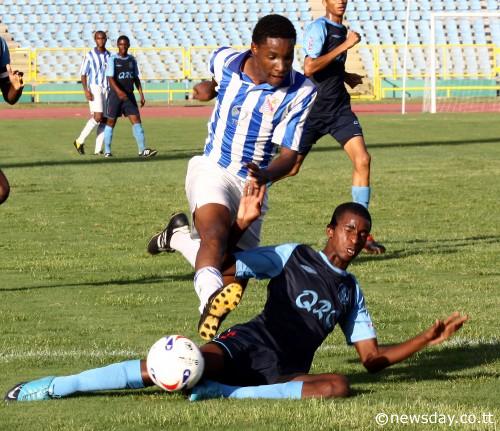 THERE is QRC's Makesi Lewis, making a desperate late tackle on St Mary's attacker Ahkil Noel during their North zone Intercol match at the Hasely Crawford Stadium, Mucurapo, yesterday. ...Author: SUREASH CHOLAI