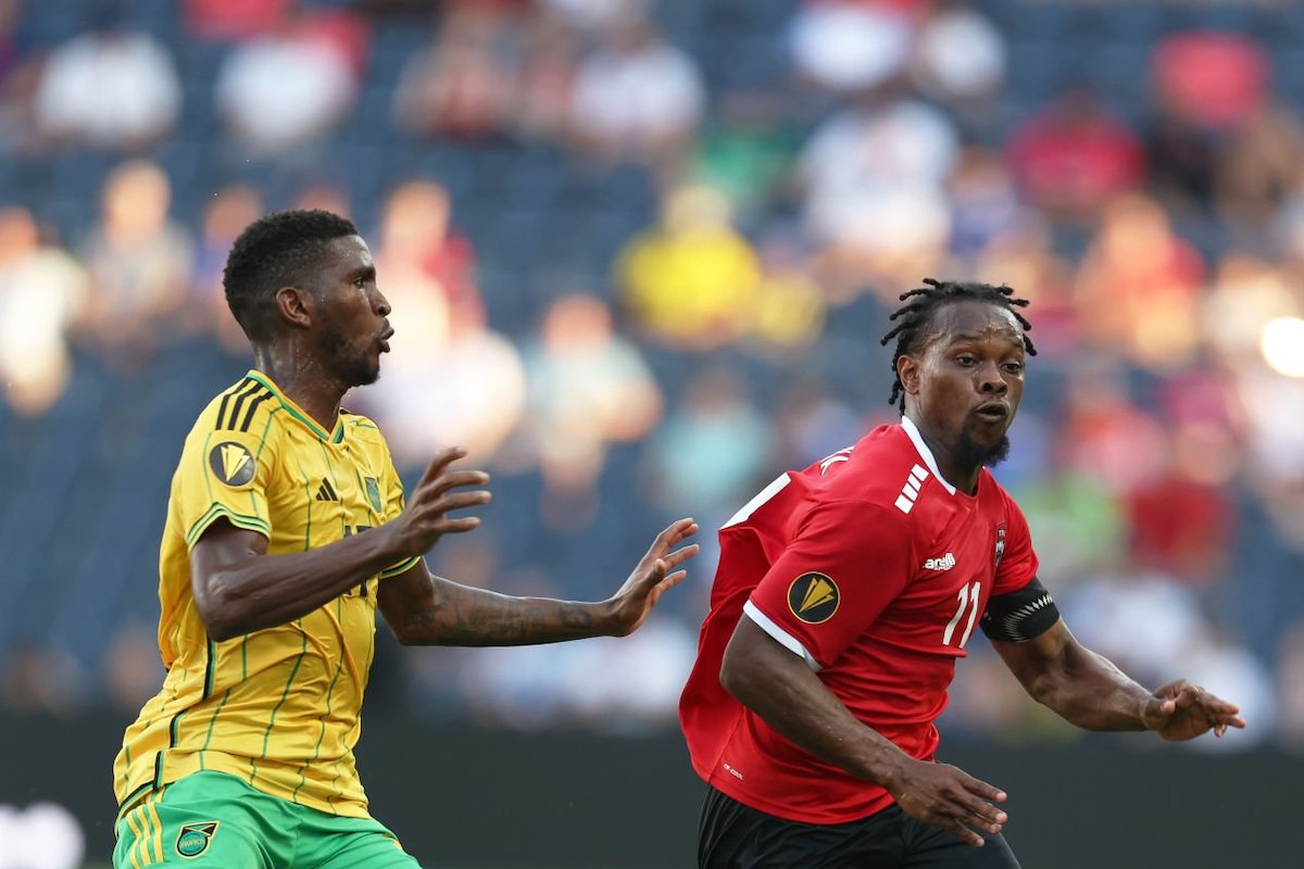 Levi Garcia #11 of Trinidad and Tobago and Damion Lowe #17 of Jamaica fight for the ball during a Group A match between Jamaica and Trinidad & Tobago as part of the 2023 CONCACAF Gold Cup at Citypark on June 28, 2023 in St Louis, Missouri. (Photo by Omar Vega/Getty Images)