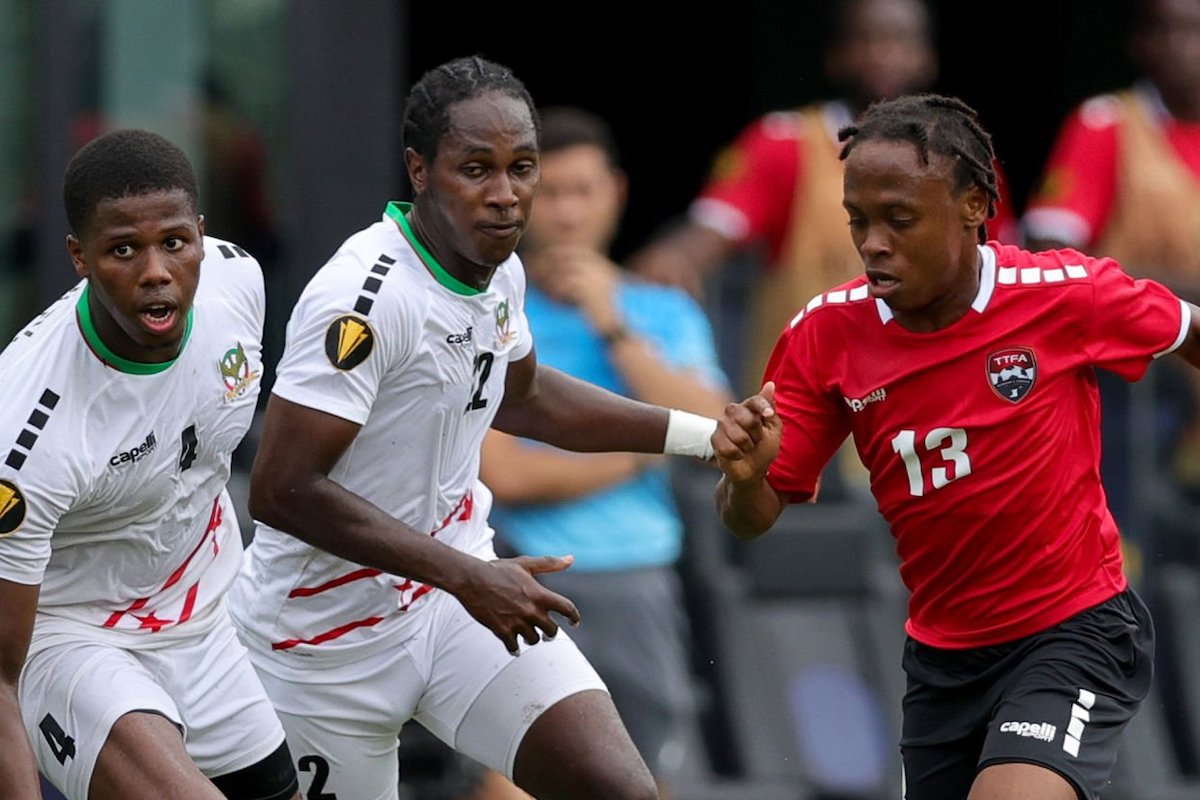 Andre Burley #4 of Saint Kitts and Nevis and Real Gill #13 of Trinidad and Tobago compete for the ball during the second half at DRV PNK Stadium on June 25, 2023 in Fort Lauderdale, Florida. (Photo by Megan Briggs/Getty Images)