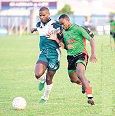 From left; W Connection's Reynold Carrington v Ian Gray of Jabloteh