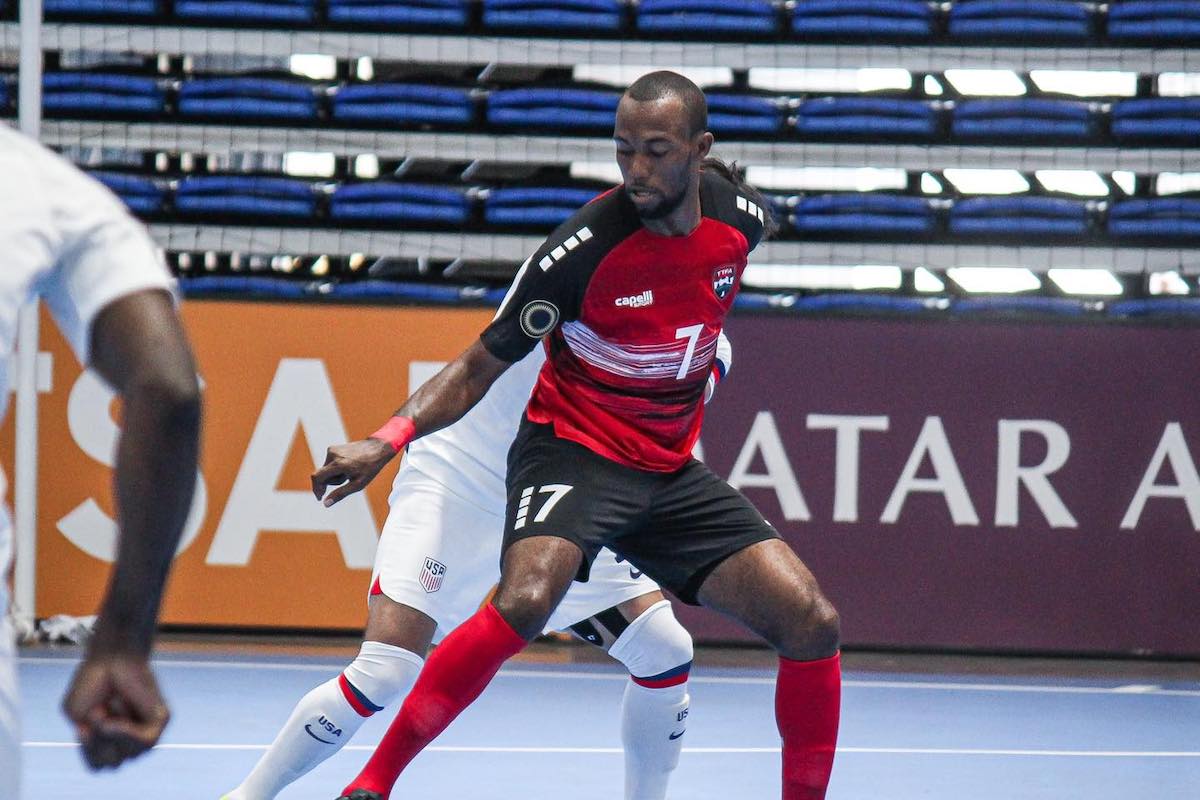 Trinidad and Tobago's Darius Ollivierra holds off a challenge from a United States player during a 2024 Concacaf Futsal Championship match at Polideportivo Alexis Arguello, Managua, Nicaragua on Saturday, April 13th 2024.