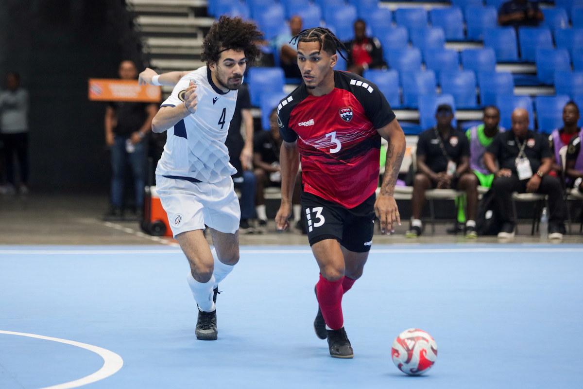Michel Poon-Angeron (right) of Trinidad and Tobago competes for the ball with Christian Gardelli (left) of Dominican Republic, during a Concacaf Futsal Championship match held at the Polideportivo Alexis Argüello stadium, in Managua, Nicaragua on Monday, April 15th 2024. (PHOTO BY Victor Straffon/Straffon Images/Mandatory Credit/Editorial Use /No Sale/No Archive)