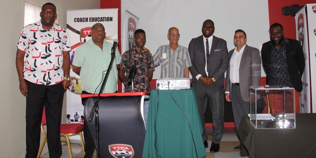 Newly elected T&T Football Association president Keiron Edwards, third from right, poses with fellow new members of the TTFA executive, ordinary member Allan Logan, from left, Andrew Boodoo (ordinary member), third vice-president Jamieson Riques, second vice-president Osmond Downer, Ryan Nunes (ordinary member) and Shelton Williams (ordinary member). Missing are first vice-president Colin Murray and Alicia Austin (ordinary member). PHOTO BY: Vashti Singh