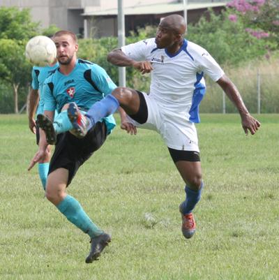 Westside Superstarz midfielder Troy Thompson, left, attempts to control the ball under pressure from WASA FC defender Kevon Henry, during the blink/bmobile National Super League rescheduled match. Photo: Anthony Harris