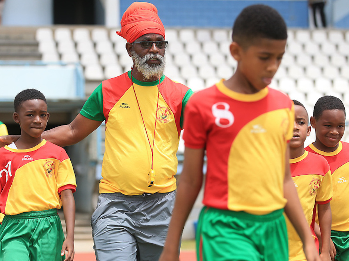 Coach Anthony "Dada" Wickham with his Trendsetter Hawks Boys U-11 team as they face QPCC FC at the Semifinals of the Republic Bank Youth League at the Larry Gomes Stadium, Arima on June 29th, 2019. PHOTO: Allan V. Crane