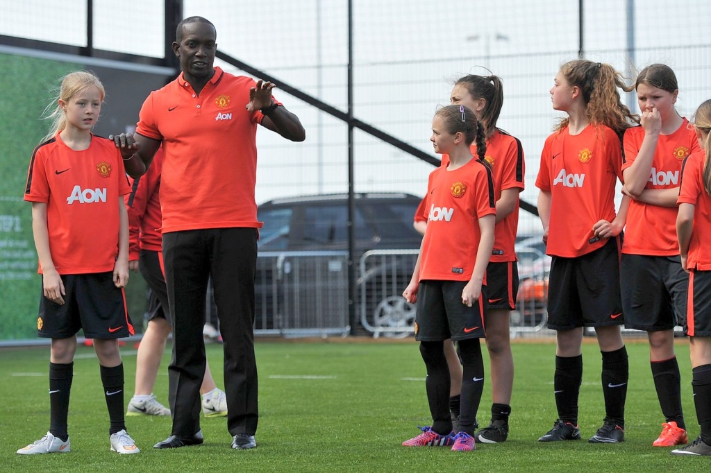 Dwight Yorke during a skills session with some of Manchester United young female players on the Apollo kick pitch at Old Trafford.