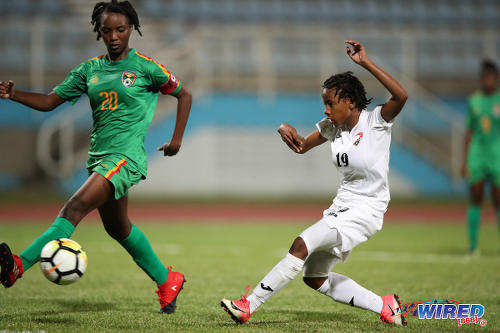 Photo: Trinidad and Tobago forward Aaliyah prince (right) tries to squeeze a shot past Grenada defender Judy McIntosh during CFU Challenge Series action at the Ato Boldon Stadium, Couva on 27 April 2018. Prince scored three times in a 8-1 win for T&T. (Copyright Allan V Crane/CA-Images/Wired868)