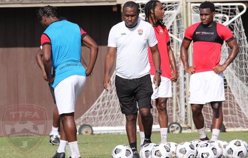 Photo: Trinidad and Tobago interim head coach Angus Eve (centre) conducts a training session in Miami before the 2021 Concacaf Gold Cup playoffs. (via TTFA Media)
