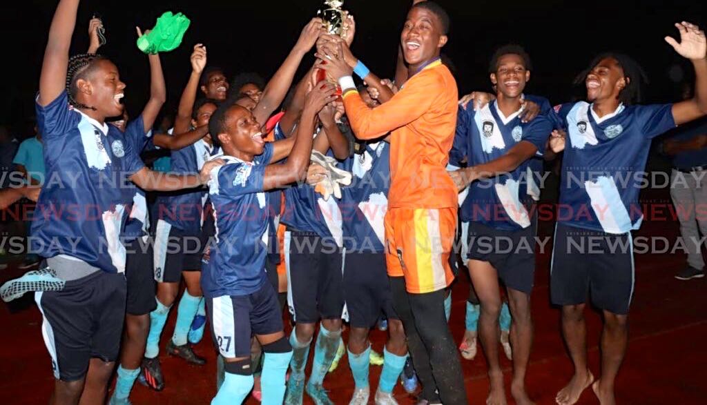 Arima North Secondary players celebrate their victory against San Juan North Secondary, on Tuesday, following the Coca-Cola East Zone final, at the Larry Gomes Stadium, Malabar. Arima won 15-14 via penalties. - Roger Jacob