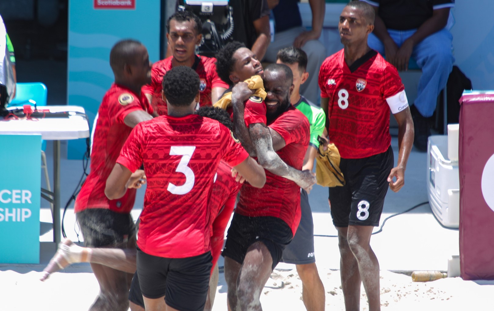 Trinidad and Tobago players celebrate their qualification to the quarterfinals of the Concacaf Beach Soccer Championship in Nassau, Bahamas after defeating the Dominican Republic on May 10, 2023.