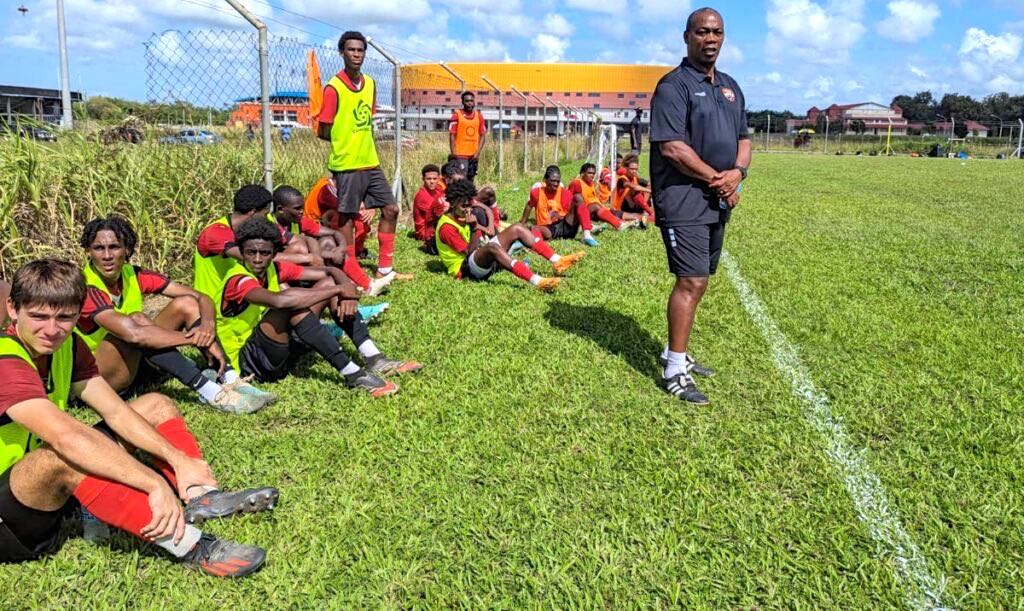 T&T men's under-20 football team coach Brian Haynes (R) watches on from the sideline during a screening session for his under-20 charges at the Ato Boldon Stadium training field in Balmain, Couva. - TTFA Media