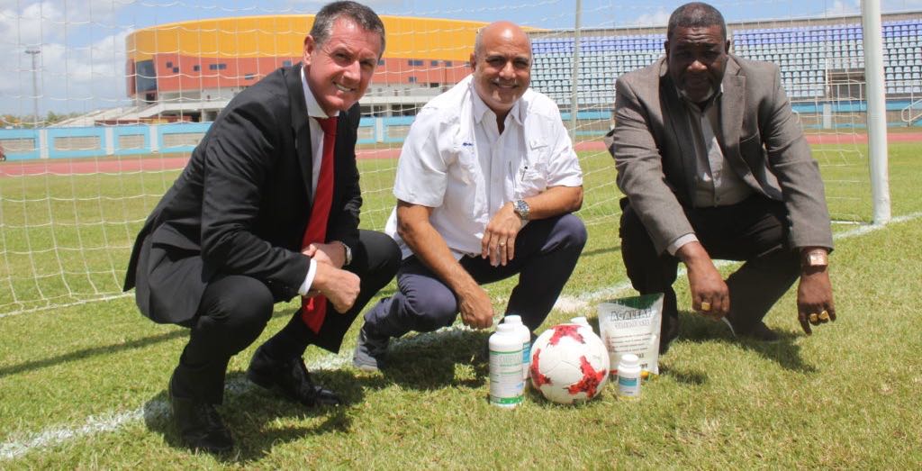 TTFA President William Wallace at right with Caribbean Chemicals chairman Joe Pires and Men’s Senior Team head coach Terry Fenwick on the pitch at the Ato Boldon Stadium. Photo: TTFA
