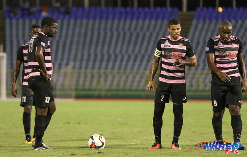 Photo: Ma Pau Stars players (from left) Glenton Wolffe, Carlos Edwards and Jason Scotland stand over a free kick during the First Citizens Bank Cup final against Defence Force at the Hasely Crawford Stadium, Port of Spain on 2 December 2016. (Courtesy Sean Morrison/Wired868)