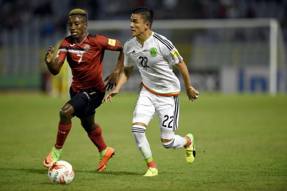 Trinidad and Tobago's forward Cordell Cato (L) and Mexico's Luis Reyes vie for the ball during their 2018 FIFA World Cup qualifier football match in Port of Spain, Trinidad & Tobago, on March 28, 2017. - (Credit: AFP/Getty Images / ALFREDO ESTRELLA)