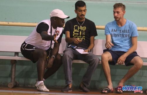 Photo: Then Trinidad and Tobago National Futsal Team coach Clayton Morris (left) gesticulates during an interview with Wired868 reporter Amiel Mohammed (centre) at the Maloney Indoor Sport Arena in March 2016.   ...(Courtesy Chevaughn Christopher/CA-images/Wired868)