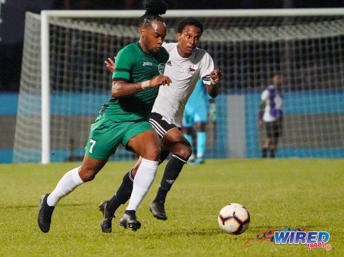 Photo: W Connection attacker Neil Benjamin Jr (left) steams past Central FC attacker Sean Bonval during Pro League action at the Ato Boldon Stadium in 12 February 2020. Benjamin scored from the penalty spot as Connection won 4-1. (Copyright Daniel Prentice/Wired868)