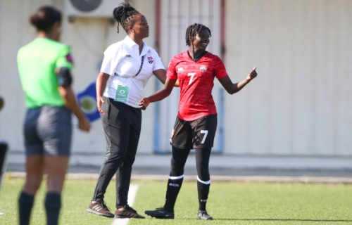Trinidad and Tobago attacker Talia Martin (right) is congratulated by coach Dernelle Mascall during Concacaf U-20 Championship qualifying action against the Cayman Islands at the Rignaal Jean Francisca Stadium, in Willemstad, Curaçao on 15 April 2023. (Copyright Miguel Gutierrez/ Straffon Images)