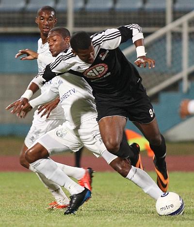 Central FC’s Dwight Quintero, right, and W Connection’s Mikheil Williams battle for the ball during one of their meetings during last year’s Digicel T&T Pro League at the Ato Boldon Stadium, Couva. Photo: Anthony Harris