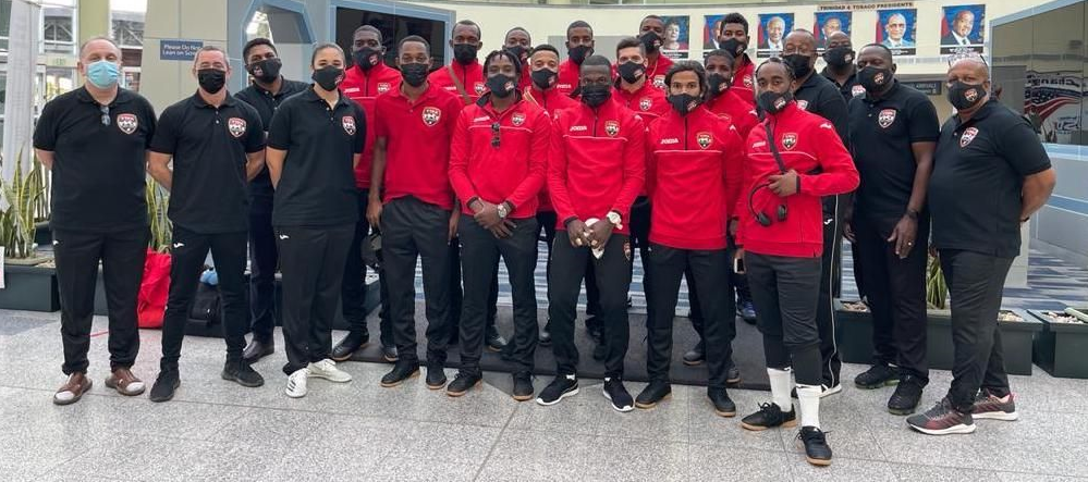 T&T’s American-born Futsal head coach Constantine Konstin, left, and his team at the Piarco International Airport on Monday. The team is off to San Jose, Costa Rica for a training camp ahead of the 2021 CONCACAF Futsal Championship in Guatemala City in May. ...Courtesy TTFA