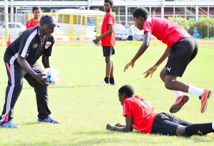 Everald 'Gally' Cummings going through the paces with the future footballers of Trinidad and Tobago. Photos Stephen Doobay