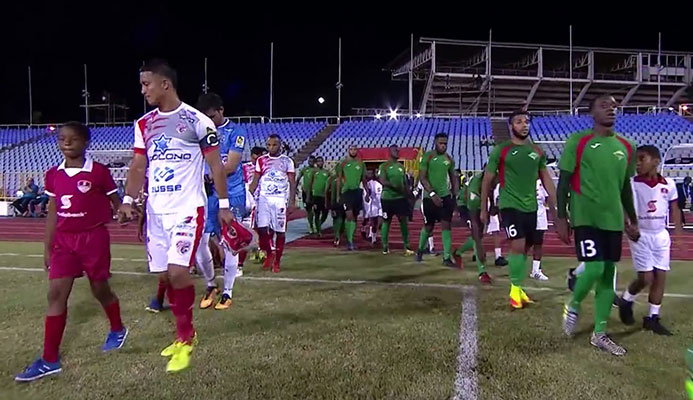Photo: San Juan Jabloteh (green) and Santos de Guapiles ahead of kick off at the Hasely Crawford Stadium in Trinidad for their second leg clash of the Scotiabank CONCACAF League Round of 16 on Aug. 8, 2017. 