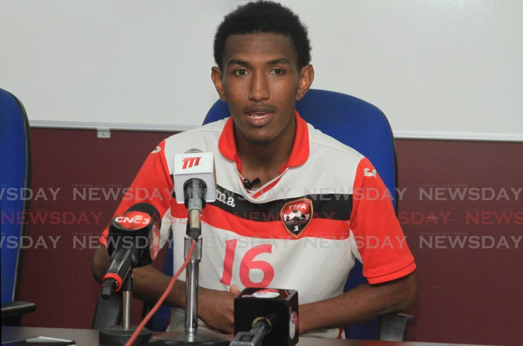 National footballer John Paul Rochford speaks to the media during a press conference at the Police Barracks Ground, St James, on Friday. PHOTO BY AYANNA KINSALE - Ayanna Kinsale