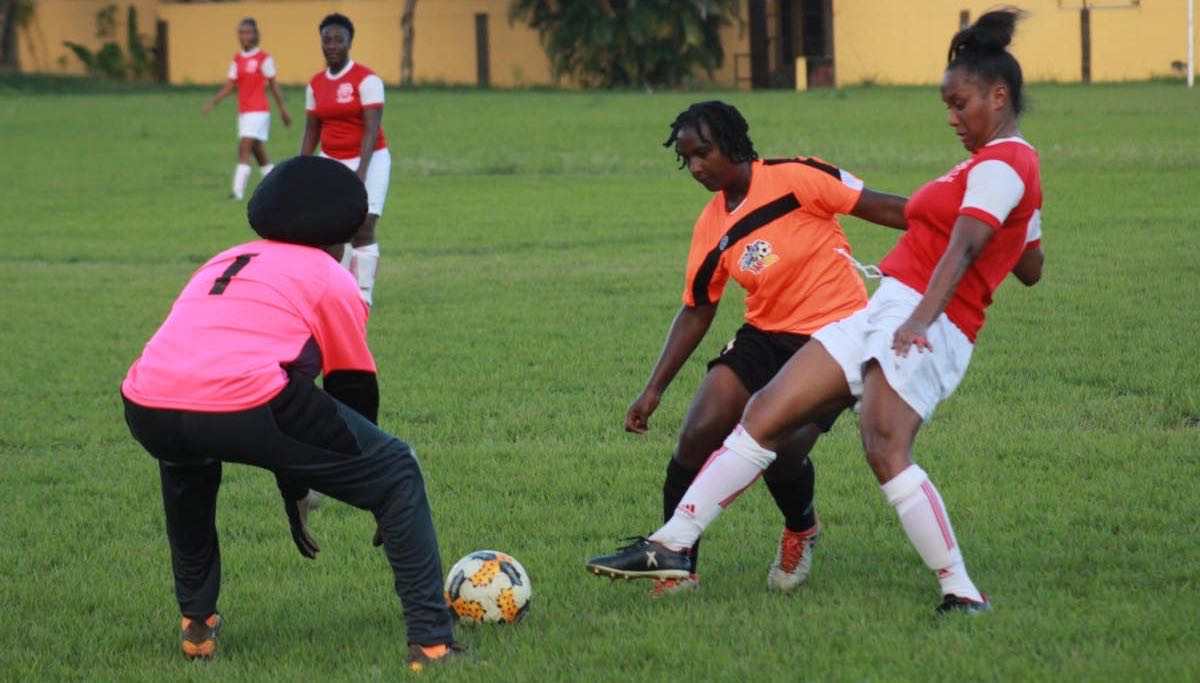 National footballer Jonelle Cato, right, in action for Trincity Nationals vs Club Sando last year.