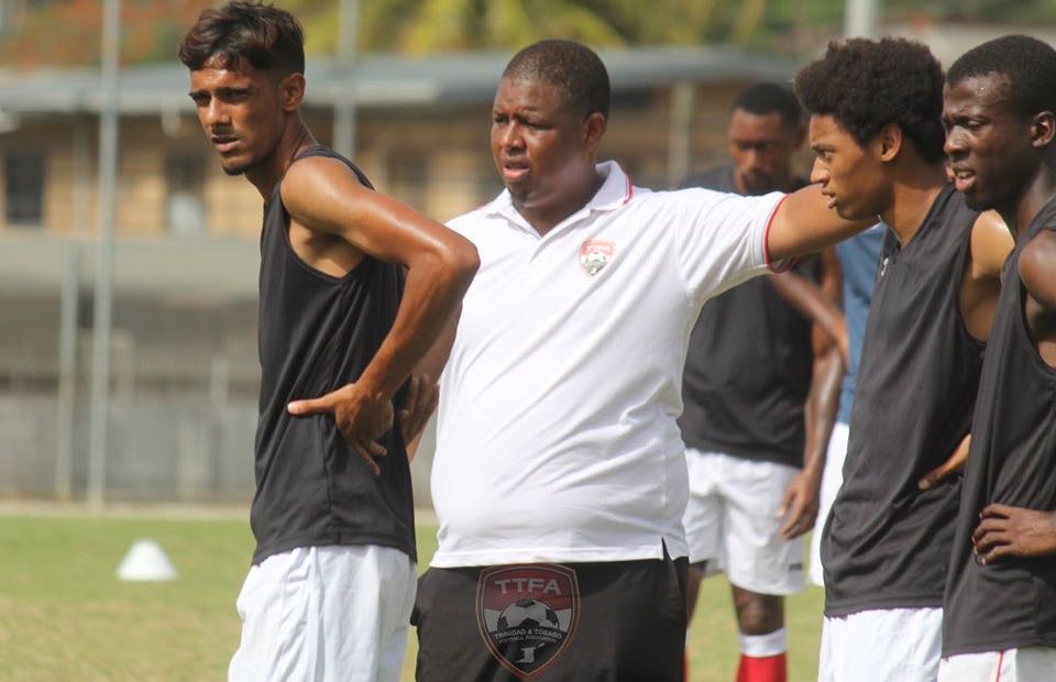 Good vibes in the T&T camp - midfielder Justin Sadoo (left) with T&T's assistant coach Derek King