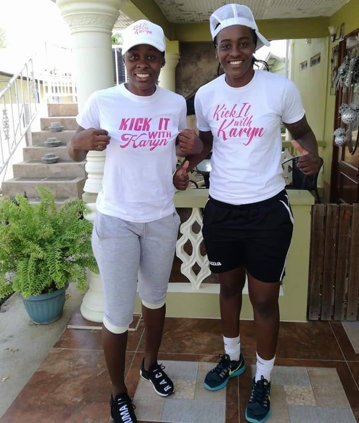 National players Karyn Forbes, left, and her sister Kimika, show their "Kick it with Karyn" jerseys ahead of the tournament tomorrow in Plymouth.