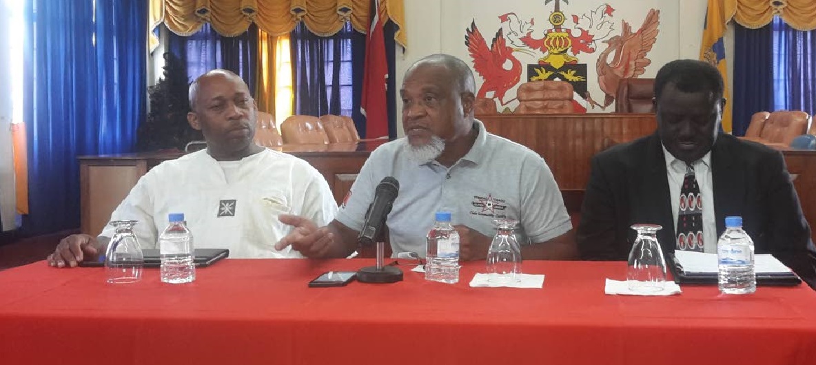 Keith Look Loy, centre, coach of FC Santa Rosa, makes a point at a press conference yesterday at Arima Town Hall. He is flanked by Clynt Taylor, left, general secretary of the Central Football Association, and Selby Browne, president of the Veteran Footballers Organisation of Trinidad and Tobago.