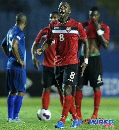 Photo: Trinidad and Tobago midfielder Khaleem Hyland (centre) roars during Russia 2018 World Cup qualifying action in Guatemala City on 13 November 2015. Hyland scored in a 2-1 win for the Soca Warriors. (Courtesy Allan V Crane/Wired868)
