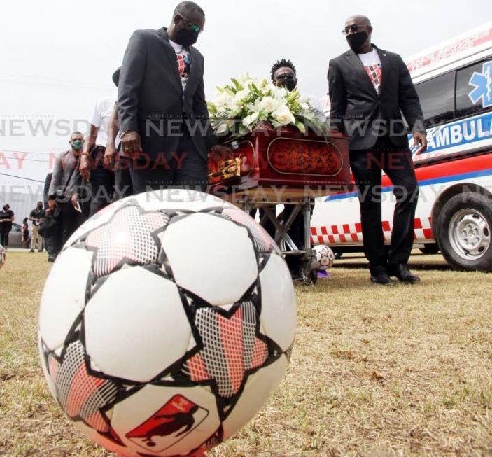 Former Strike Squad members carry the casket of former team-mate Larry Joseph at his funeral, on Wednesday, at the La Brea Recreation Ground, La Brea. Joseph passed away on February 17. He was 56. - Lincoln Holder